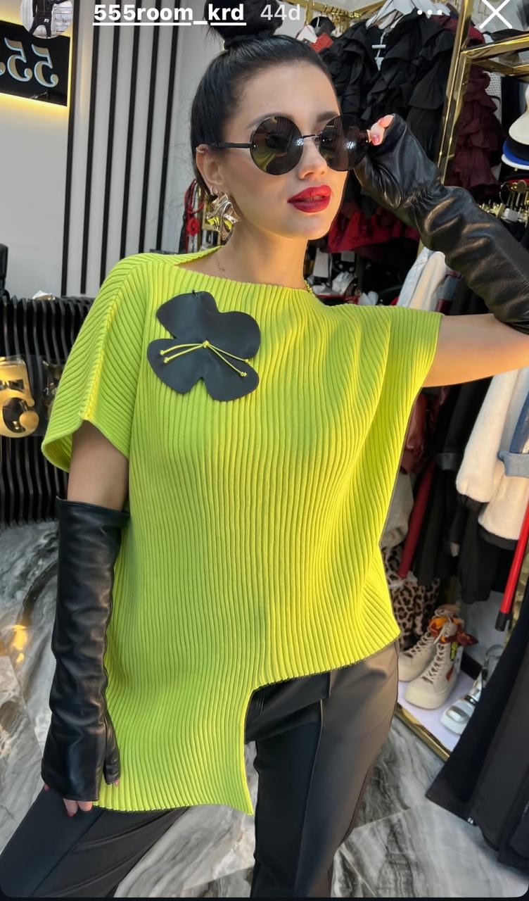 Bize Asymmetrical Knit Top with Flower Accent