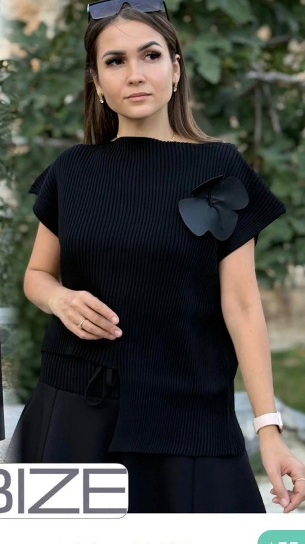 Bize Asymmetrical Knit Top with Flower Accent