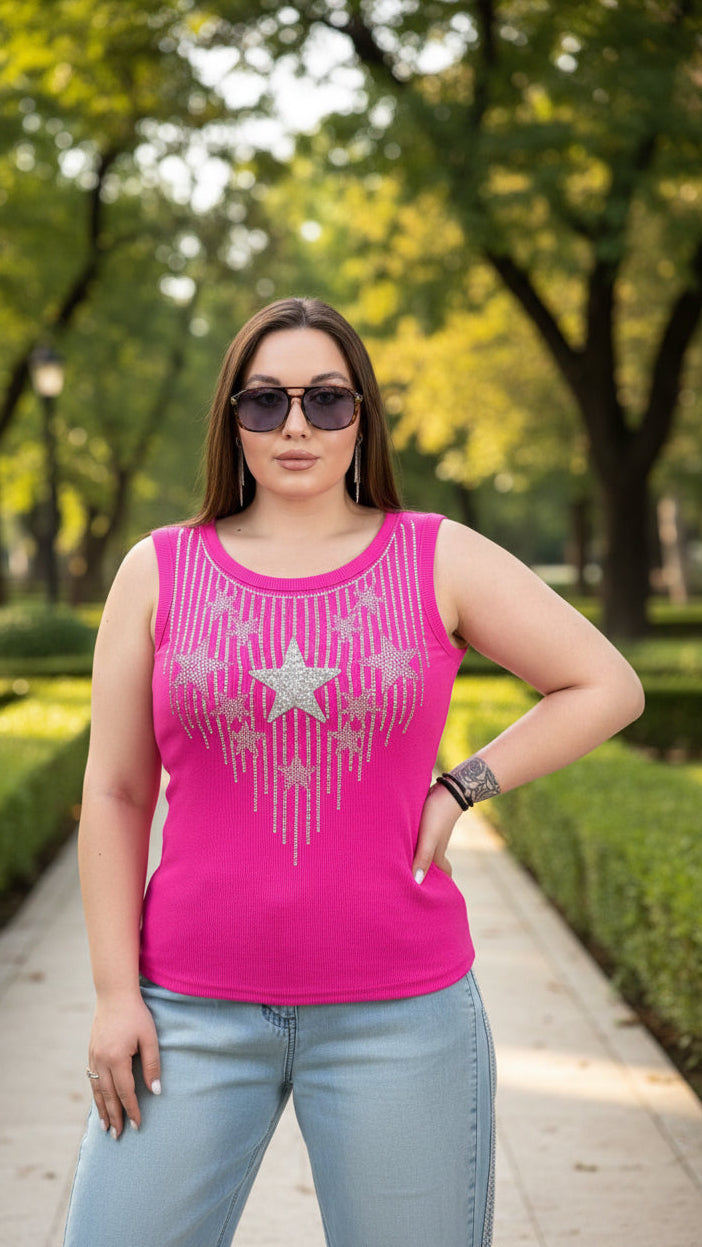 Woman wearing a pink tank top with star designs outdoors